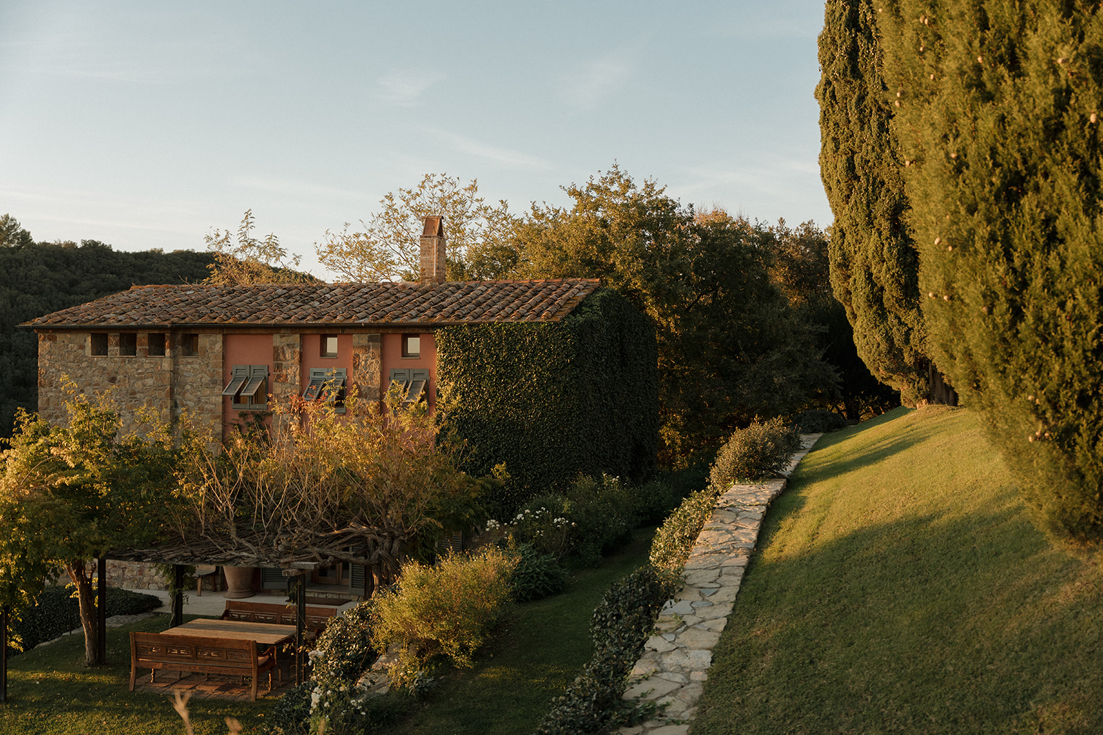 Open-air wedding reception space with a panoramic view of the Tuscan countryside, ideal for a destination wedding celebration