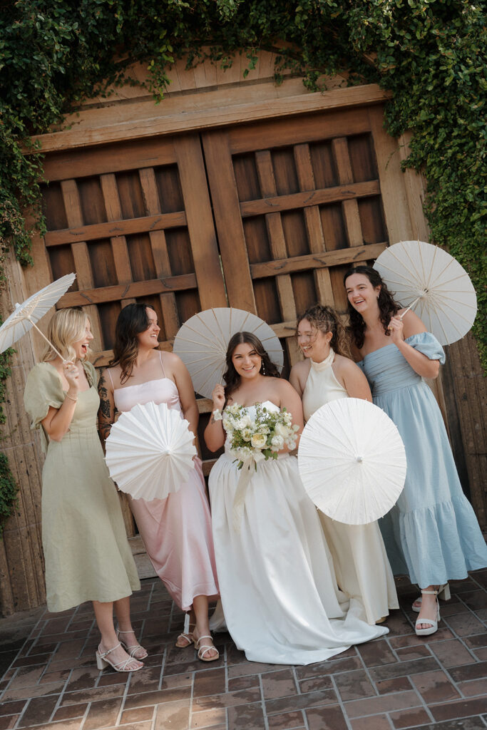 Bridesmaid dresses in pastel tones bringing color and joy to this butter yellow wedding.